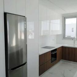 High Gloss Kitchen A Combination Of Melamine In Wood Color And Mdf Coated With White Glossy Surface